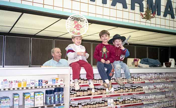 1990 photograph of the Anderson family, longtime owners of Oswald’s Pharmacy in Illinois, how to grow your pharmacy business