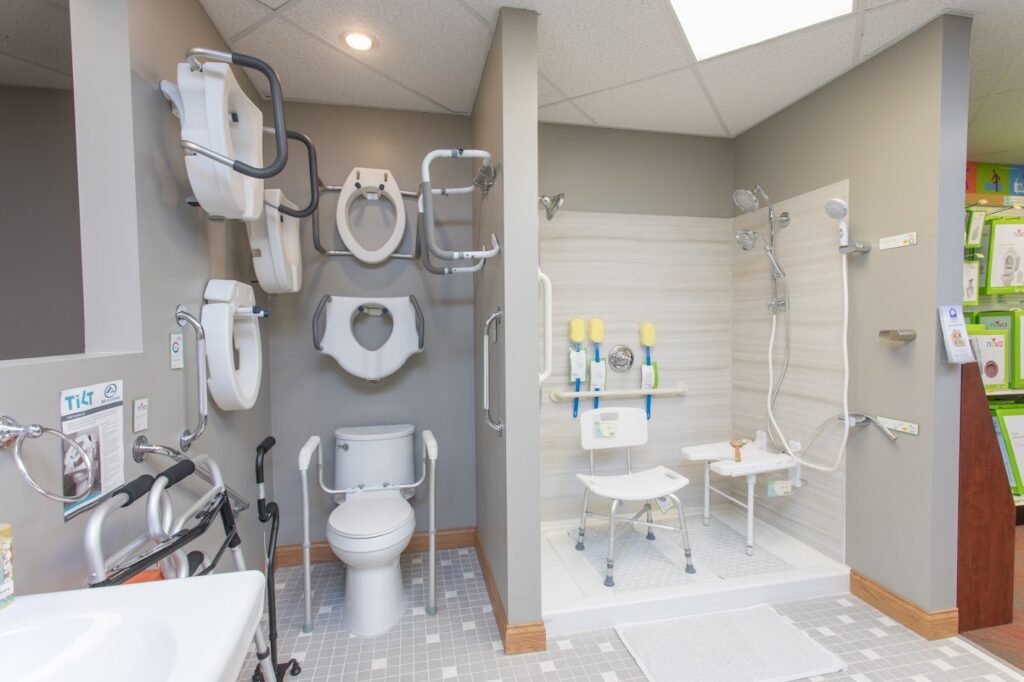 A robust NOVA bathroom safety product retail display with full example sink, toilet and shower at Oswald's Pharmacy.